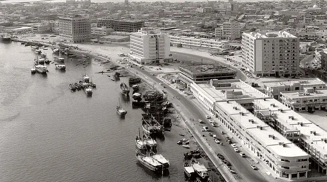 A black and white photo of the Dubai Creek in the 1960s.